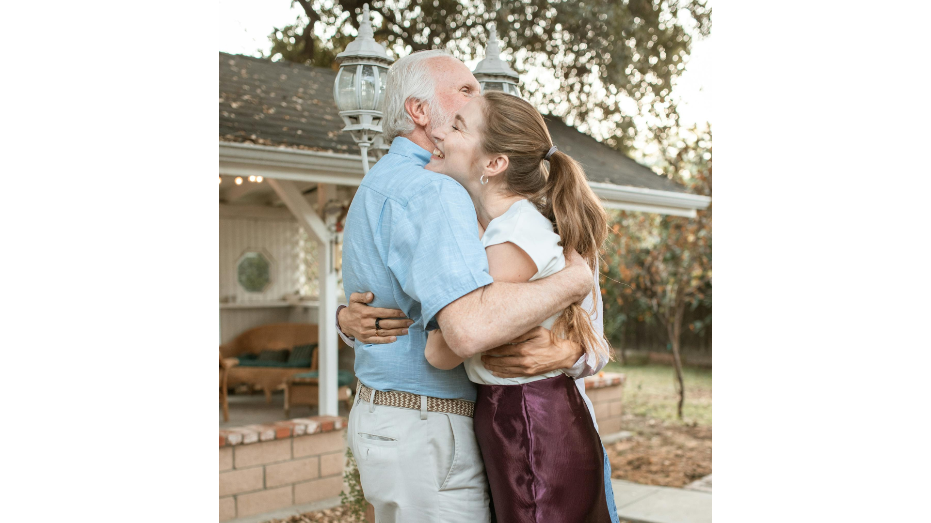 Aging dad hugging his daughter