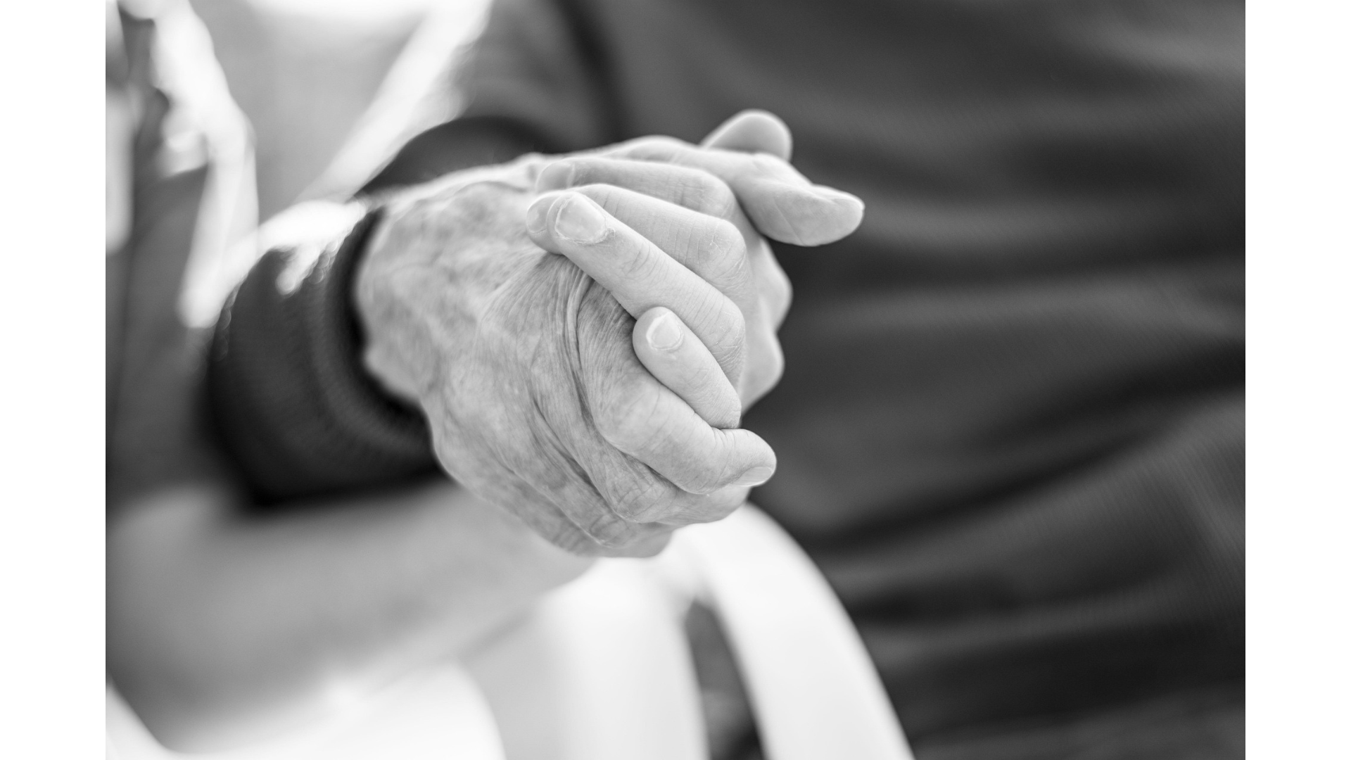 siblings and elderly parents - daughter and father holding hands